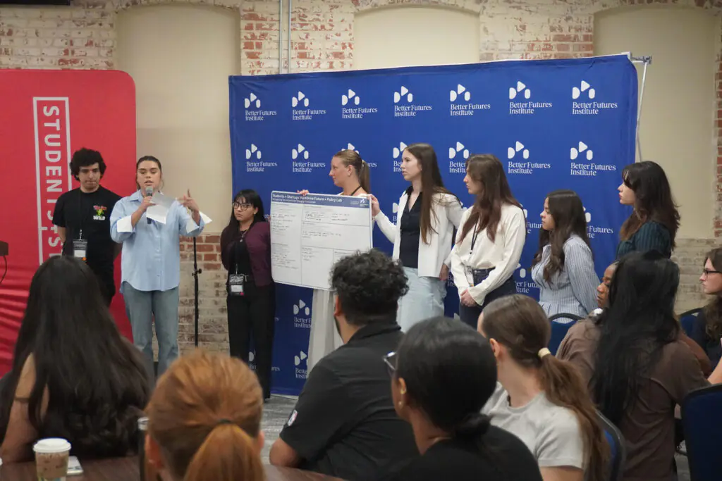 Student team sharing their policy lab worksheet at the San Antonio Workforce of the Future event – urban planning outreach by Urban Alchemy Collective