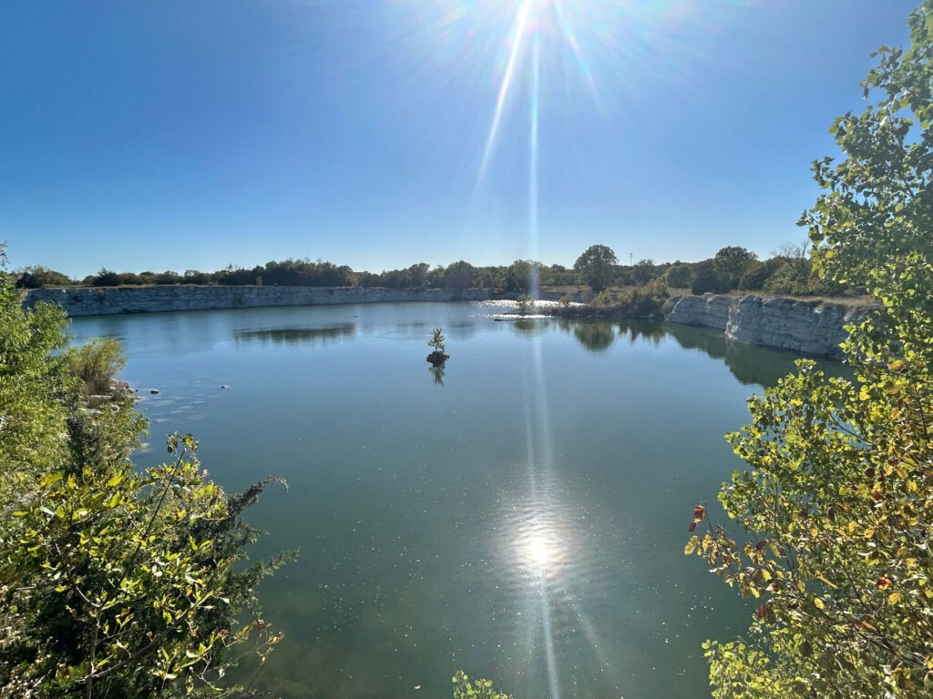 Sunlit quarry lake at the future Phillips Quarry Park – site visit for landscape architecture and parks planning by Urban Alchemy Collective